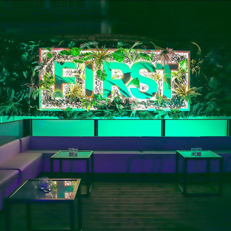 First Club nightclub Milan view of the couch table booking sit down area fresh design