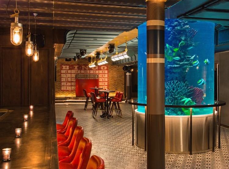 Fishbowl nightclub New York City fish aquarium bar view dance floor seats book your table go out