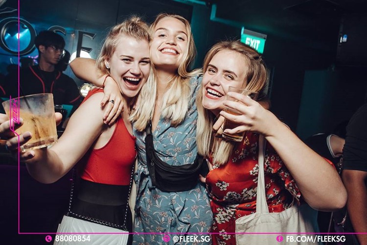 Fleek nightclub Singapore blonde girls having fun party night show event music live