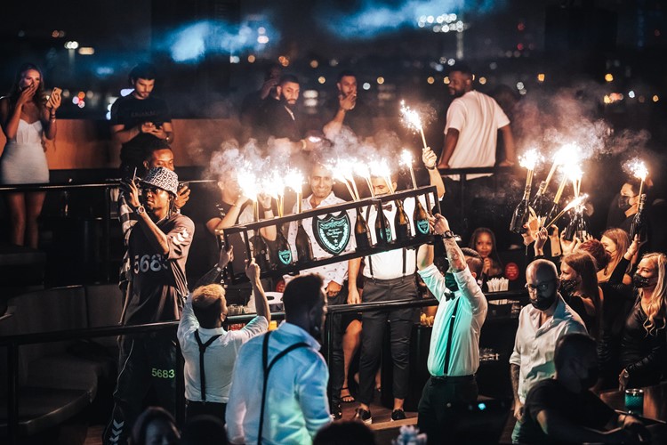 Float nightclub Dubai fun party book vip table celebrate bottles parade