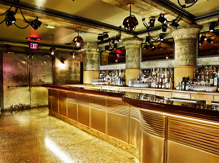 gilded lily nightclub new york luxury modern design interior golden furniture view of the bar with alcohol bottles