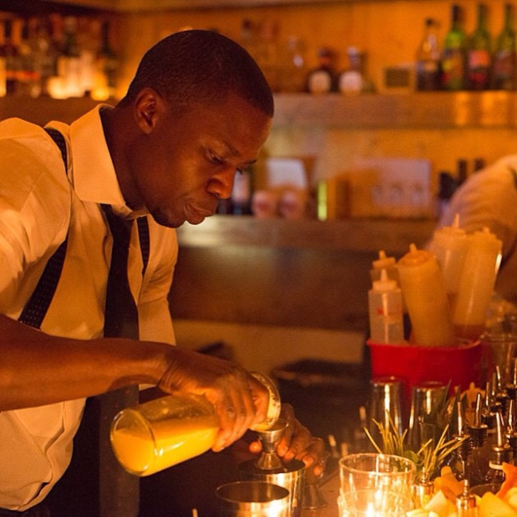 Goldbar nightclub New York City barman pouring drinks gold luxury design