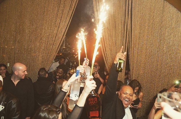 Goldbar nightclub New York City gold luxurious interior design bottle service men drinking