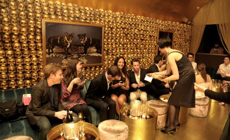 Goldbar nightclub New York City gold luxurious interior design people drinking waitress old school style