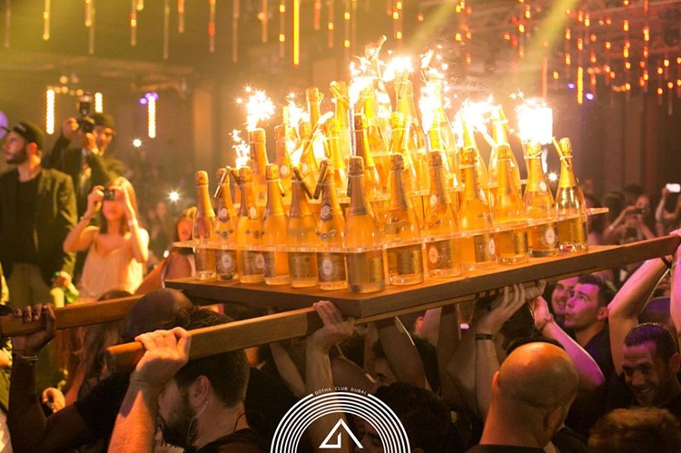 Gotha nightclub Dubai waiters bringing many bottles of alcohol