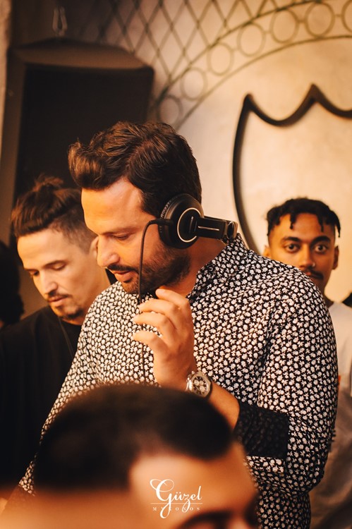 Guzel nightclub Mykonos guy having fun vip table reserve book now open during pandemic