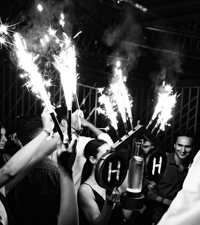 HRoof nightclub Cancun book your own vip table reserve now alcohol bottles vodka champagne rum gin cocktails