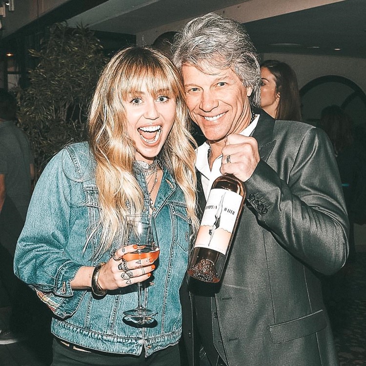 Harriets club Los Angeles celebrity singer Miley Cirus celebrating having fun drinking cocktails champagne expensive posh drinks reserve now