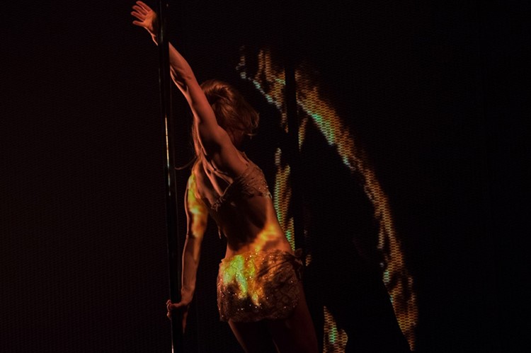 Heart nightclub Ibiza sexy dancer dressed in gold glitter mini dress pole dancing