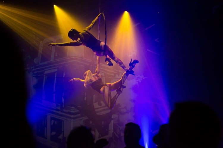 Heart nightclub Ibiza exotic dancers acrobats flying on wall suspended circles