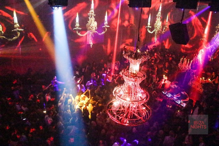 Heart nightclub Ibiza crowd having fun at big event chandelier interior design