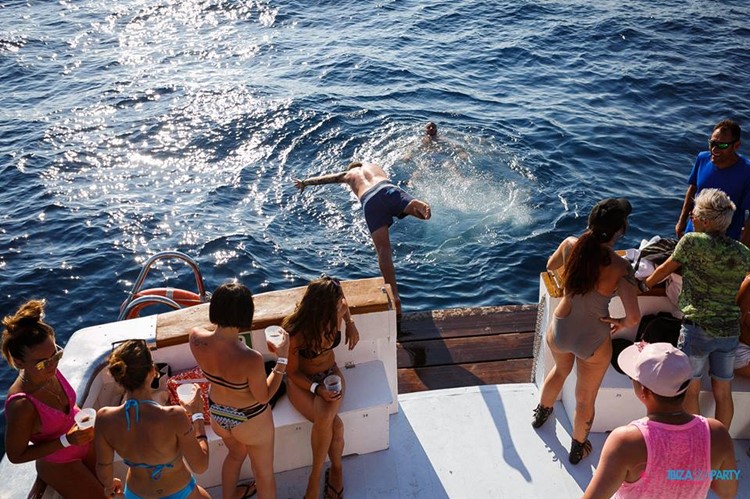 Sea Party Ibiza yacht man jumping in water girls dancing
