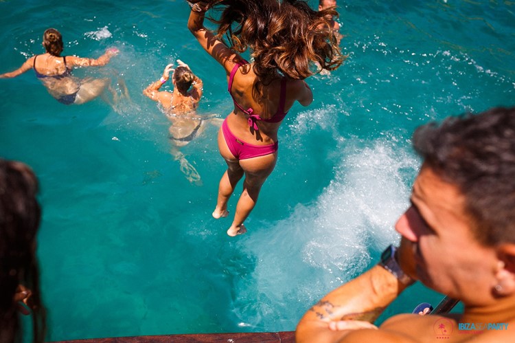 Sea Party Ibiza yacht girl jumping in the water blue sea
