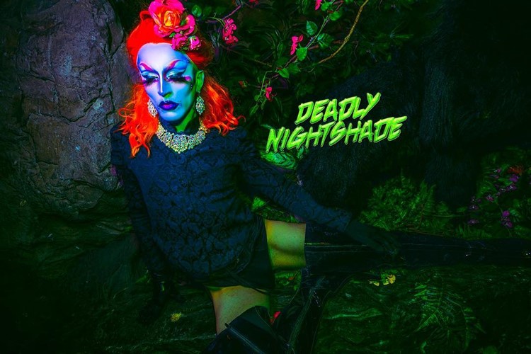 Transvestite with red wig at Jungle Club in London