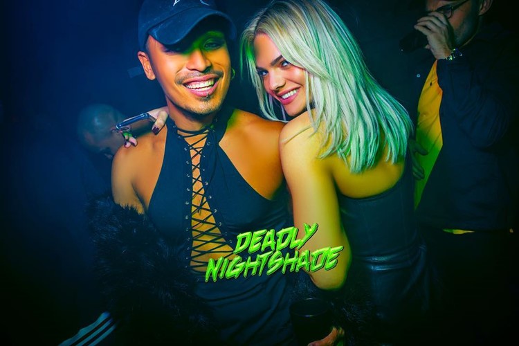 Blonde Louisa smiling at Jungle nightclub London