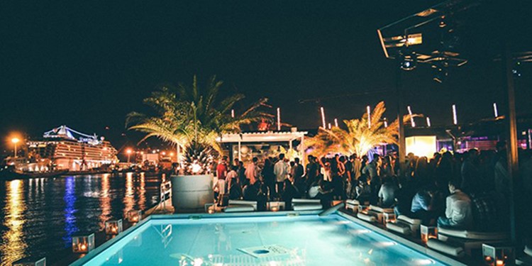 K Urban Beach nightclub Lisbon view of the swimming pool people having fun dancing drinking