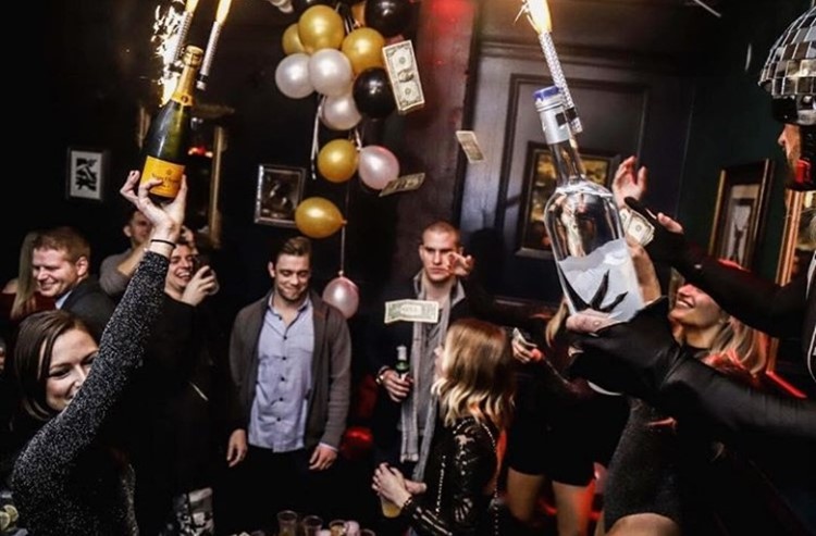 Key Club nightclub Chicago people celebrating having fun holding bottles