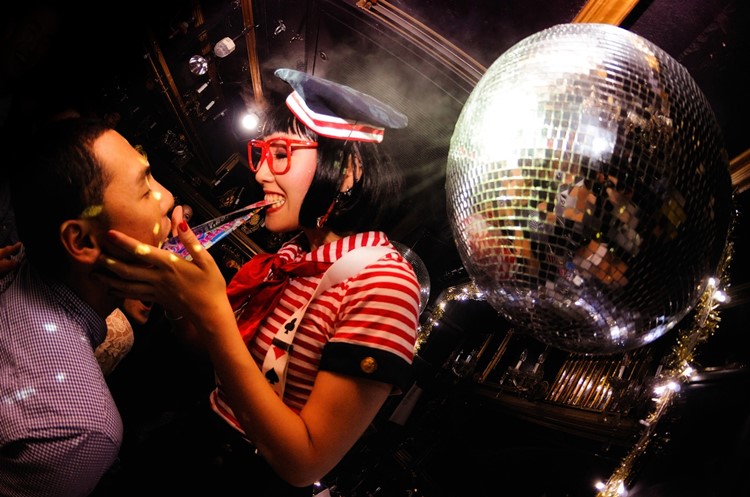 Kitsune nightclub Tokyo girl having fun disco ball