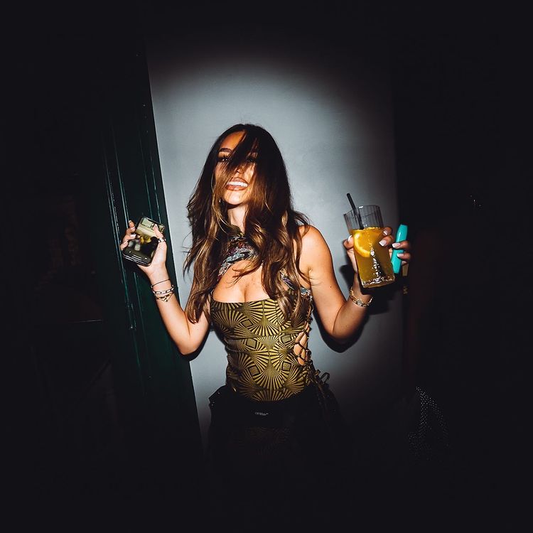 Kymbo nightclub Mykonos pretty brunette girl dancing guest list fun