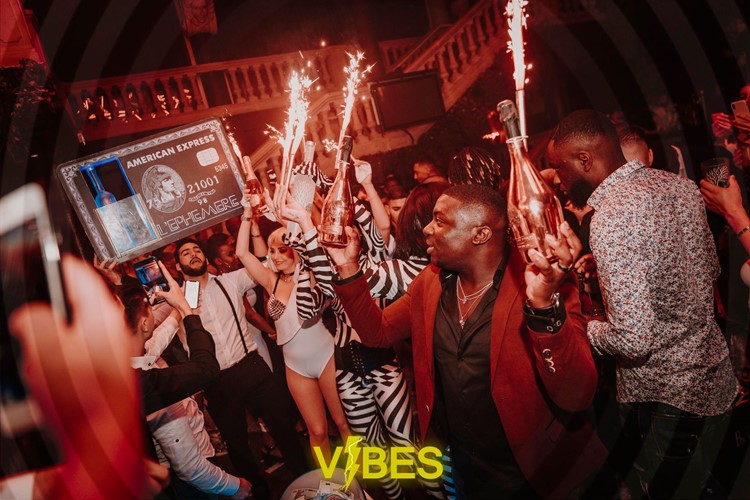 L Ephemere nightclub Paris alcohol bottles celebration fun party champagne show book your own table now