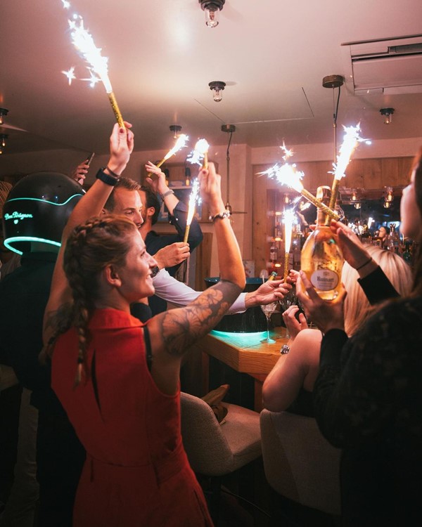 La Petite Plage restaurant club St Tropez champagne vodka rum gin cognac whisky bottles parade celebration