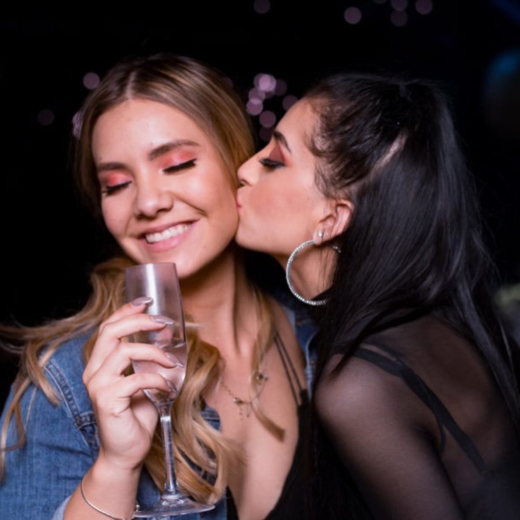 La V club in Miami pretty girls kissing champagne drinks 