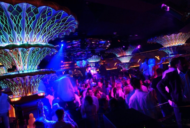 Les Caves nightclub Saint Tropez colored lights crowd having fun