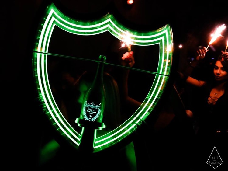 Lost and Found nightclub Toronto people having fun girls holding bottles of champagne vodka