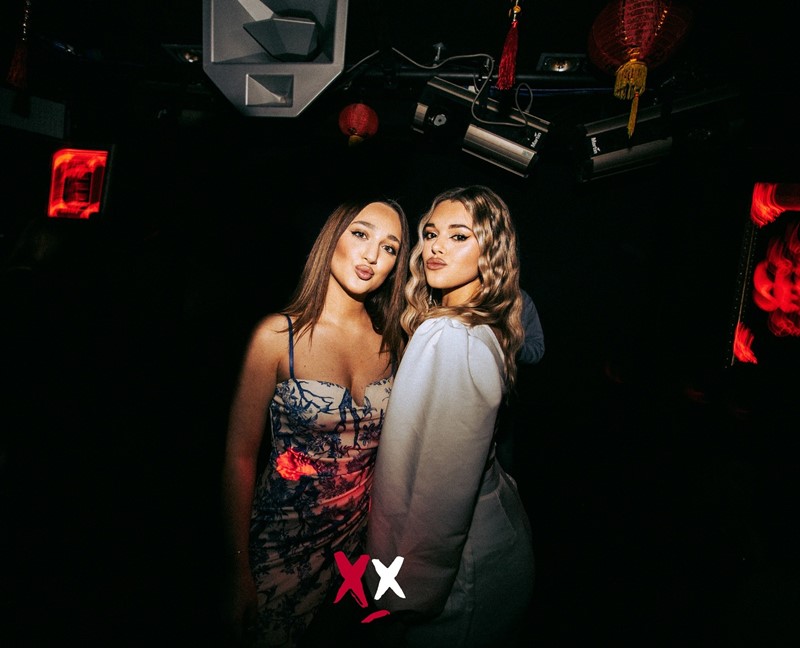 Luxx nightclub London sexy dancer dancing on stage show lights people partying all night long