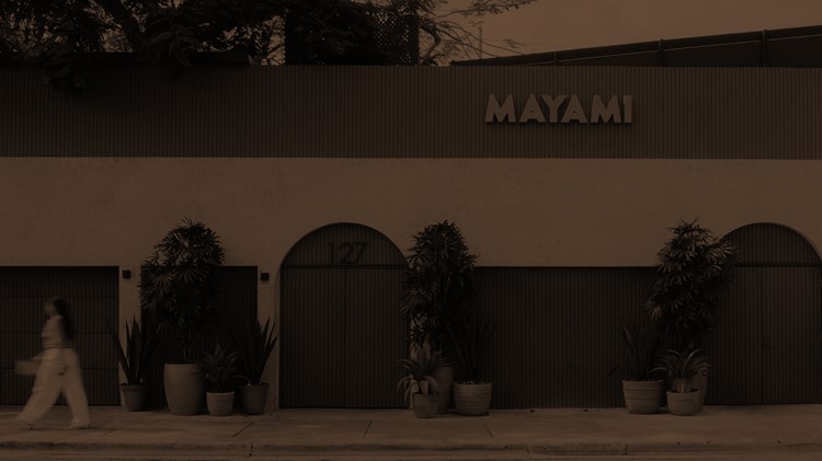 Mayami Wynwood facade at night with three arched entrances and 127 street number