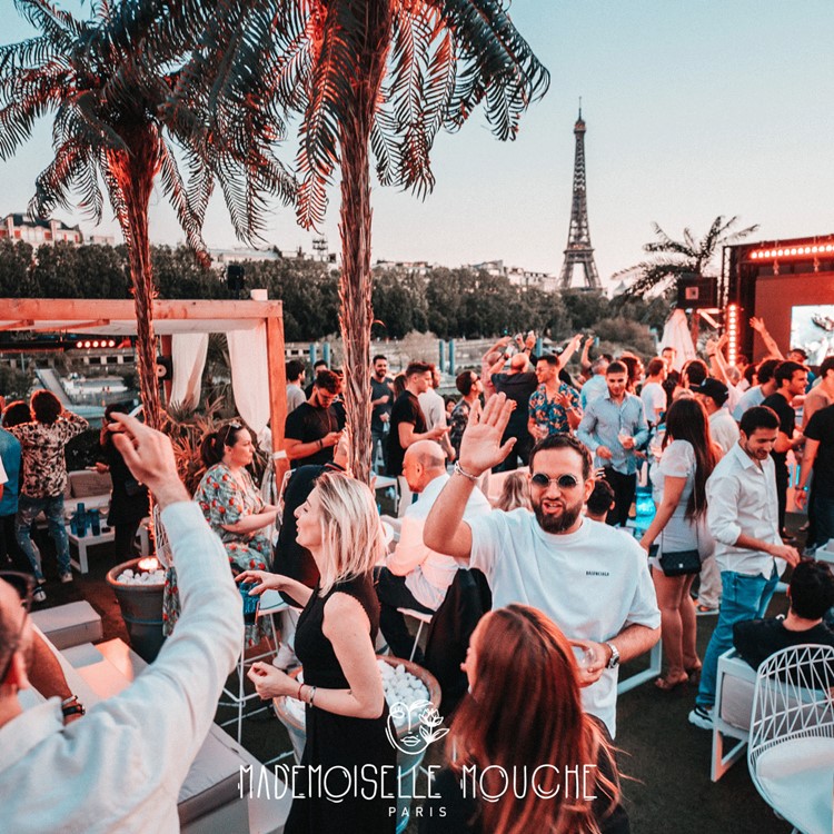 Mademoiselle Mouche club in Paris crowd Parisian Eiffel Tower prime location river