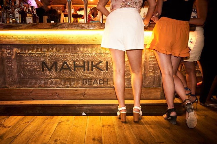 Mahiki Marbella day club beachclub bar girls in mini skirt alcohol drinks bottles