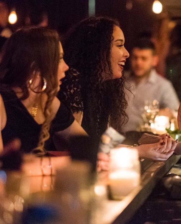 Maison Saint Paul nightclub Montreal girls men ordering drinks partying have fun tonight go out posh club fancy