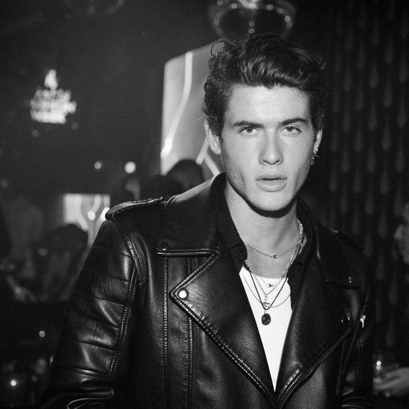 Matignon nightclub Paris beautiful blonde girls having fun blowing kiss dressed in white and black mini dresses