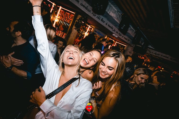 Medellin nightclub Paris pretty blonde brunette girls having fun dancing drinking cocktails partying all night