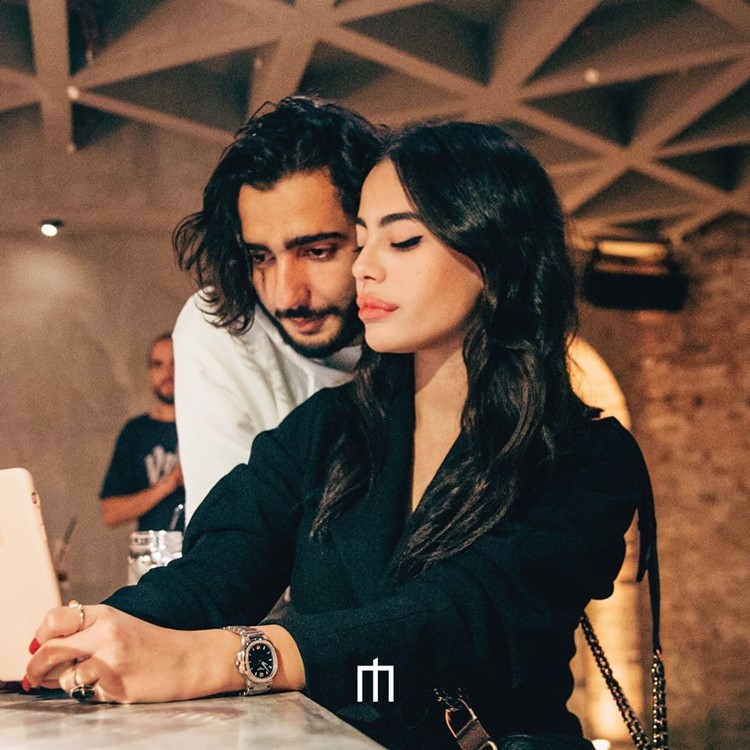 Moloko Pigalle nightclub Paris girl and guy chatting partying one of the best clubs weekend parties alcohol drinks