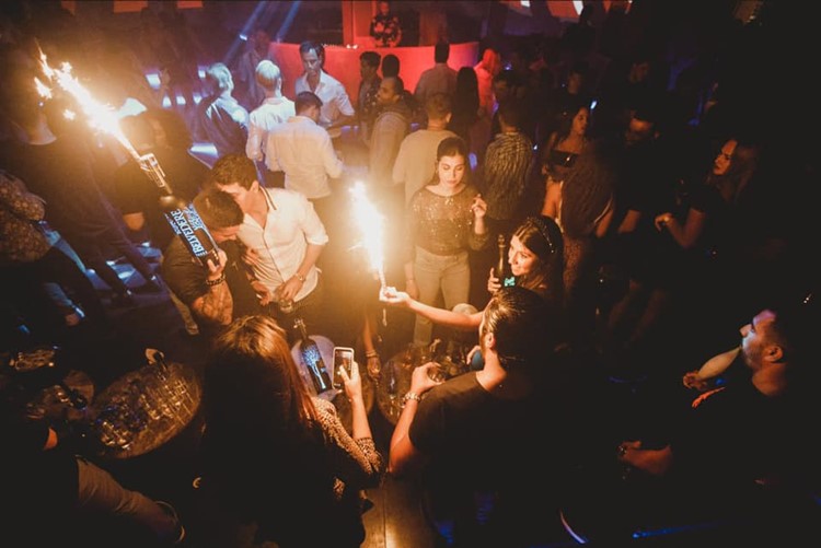 Momento nightclub Marbella celebrate book your own table now reserve vip area alcohol bottles champagne vodka rum gin