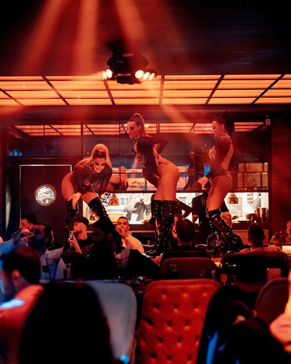 Mosh nightclub Marbella fun party dancers on table exotic costumes show sexy