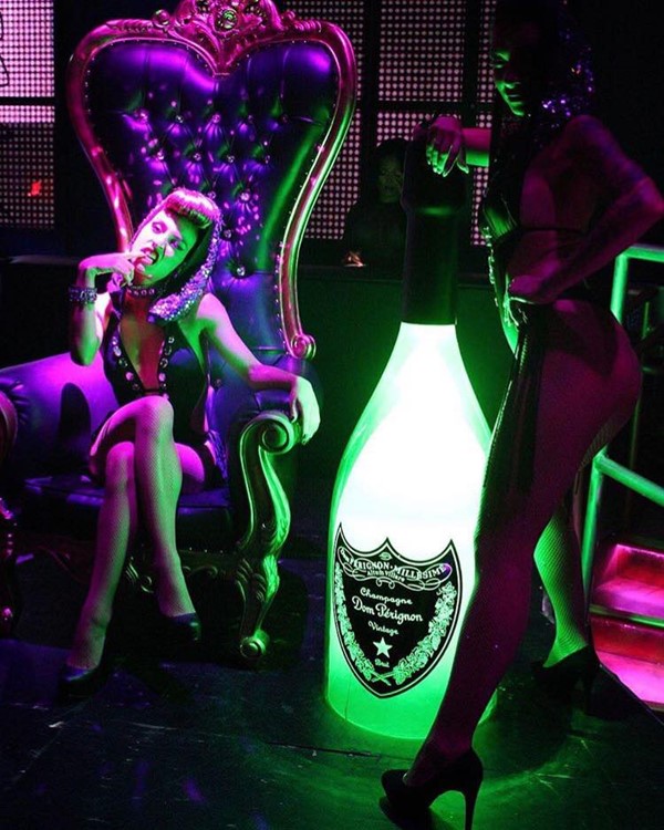 Mr Jones nightclub Miami sexy exotic dancer with big champagne bottle alcohol