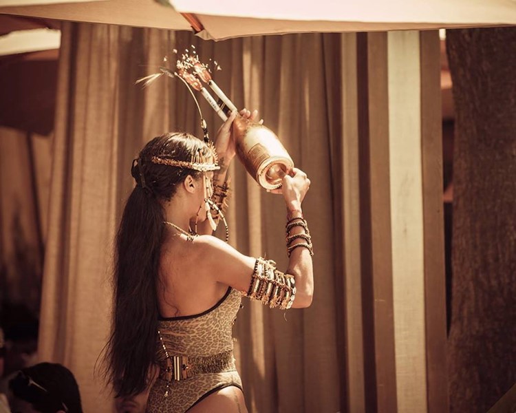 Nao Pool Club Marbella waitresses with big bottle of champagne celebration party