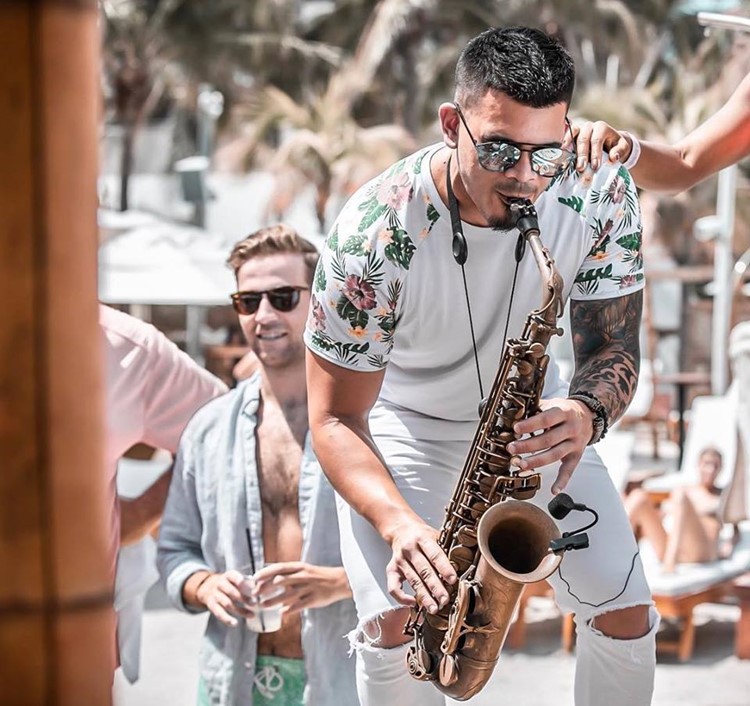 Nikki Beach beachclub Miami saxophone musician player all white party