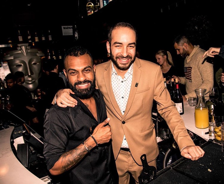 Noir nightclub New York bartender drinks cocktails alcohol bottles gin vodka bubbles bar