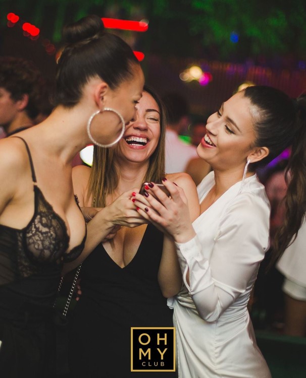 Oh My Club in Madrid nightclub girls having fun laughing pretty mini dress 