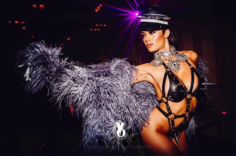 Olivia Valere nightclub Marbella beautiful dancer dressed in sexy leather bodysuit and fur jacket
