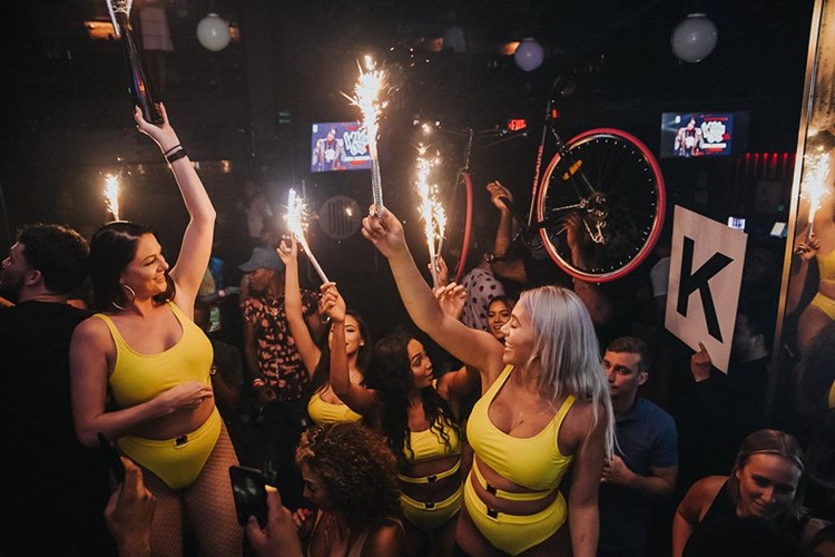 Ono nightclub Orlando party sexy waitresses with big alcohol bottles vodka champagne