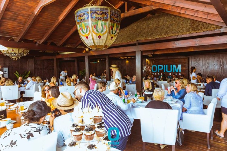 Opium Beach Club Marbella sit down drink eat restaurant side summer venue go out party have fun