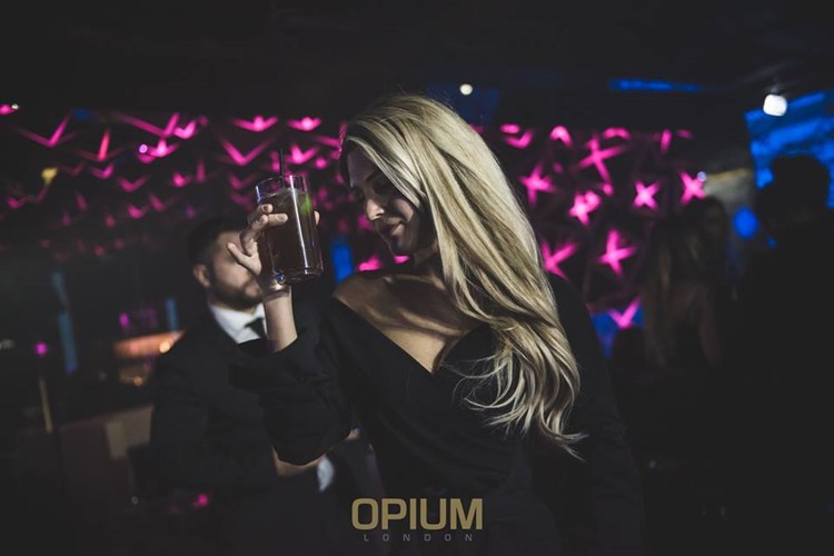 Opium nightclub London sexy blonde girl having fun mini little black dress