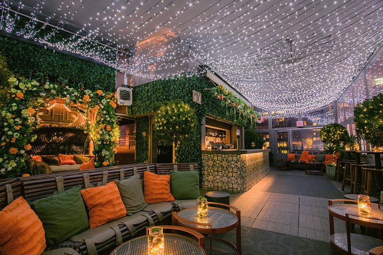 PHD Terrace club New York City posh interior design fairy lights luxury couches dance floor bar view