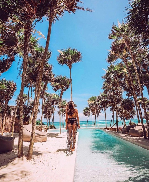 Papaya Playa beach club Tulum swimming pool girl bikinis gorgeous view outdoor palm trees
