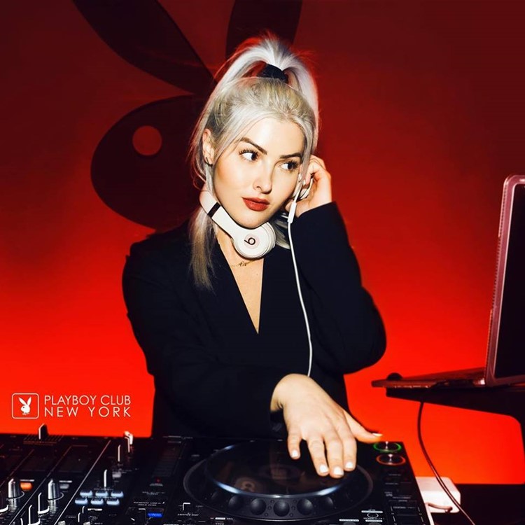 Playboy nightclub New York blonde dj girl red lipstick mixing music for event show party